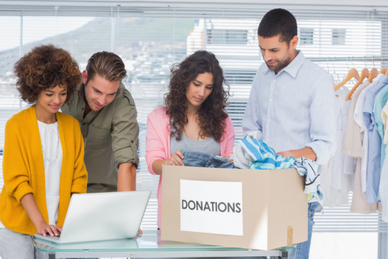 a group of people preparing some donations